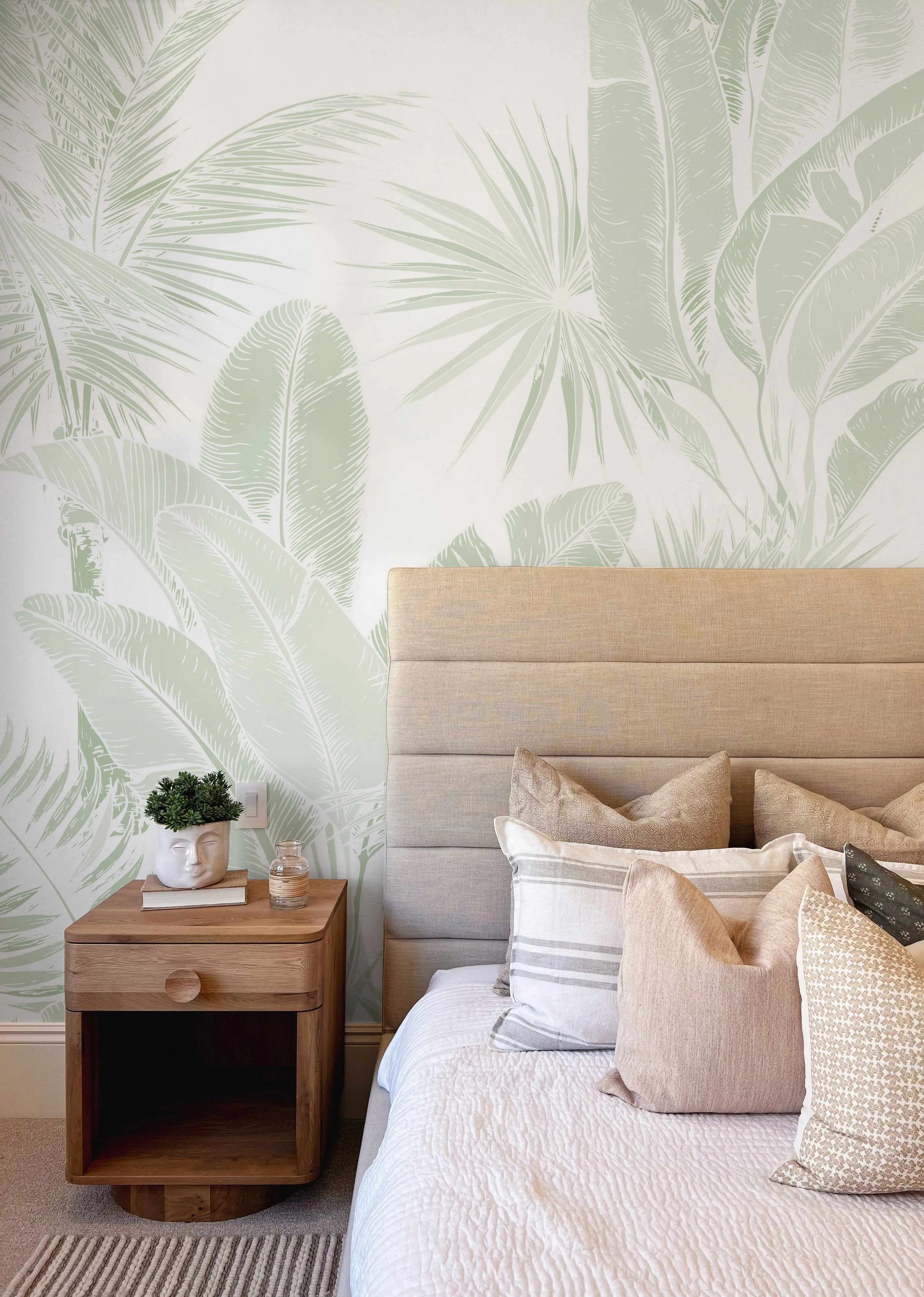 Soft botanical wallpaper in a bright bedroom